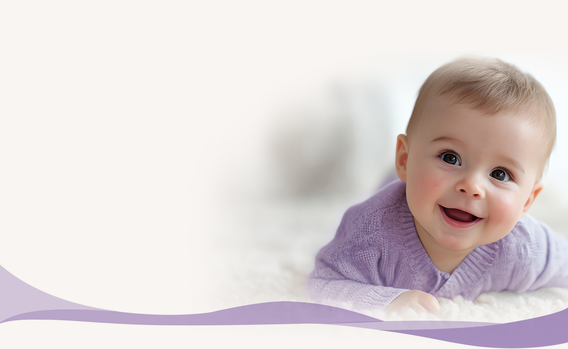Smiling baby wearing a lavender cardigan